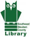 The Southeast Steuben Country Library logo of a green cartoon owl sitting on a stack of green library books